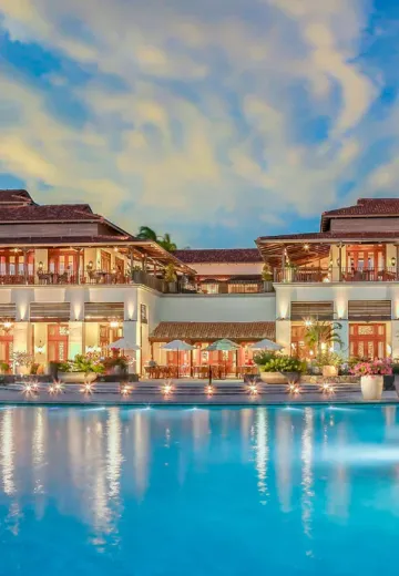 Swimming pool and main hacienda buliding at JW Marriott