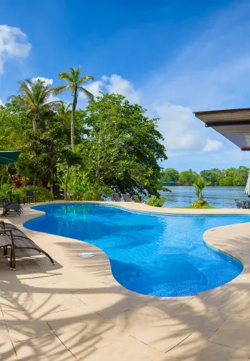 Pool area and river view at Manatus