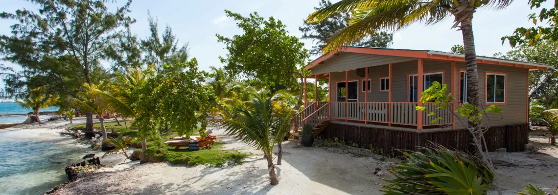 Cottage Exterior and oceanfront at Coral Caye